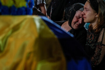 Погибшие украинцы / Фото: REUTERS - ALINA SMUTKO