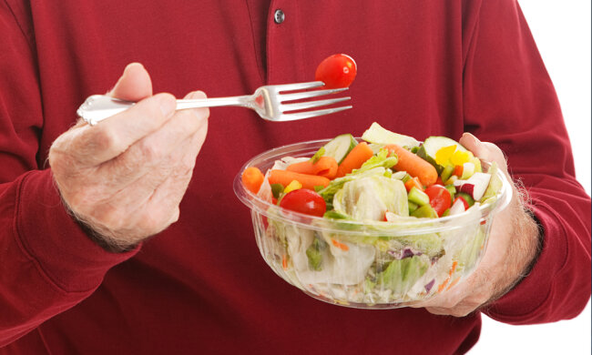 Senior Man Eats Salad — Closeup