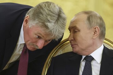 Дмитро Пєсков та Володимир Путін