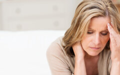 Woman suffering from stress grimacing in pain