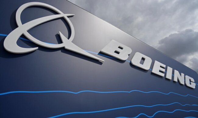 Signage for Boeing is seen on a trade pavilion at Farnborough International Airshow in Farnborough, Britain
