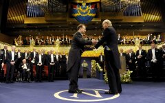 Adam Riess of the U.S. receives the Nobel Prize for Physics from Swedish King Carl Gustaf  at the Concert Hall in Stockholm
