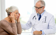 senior woman and doctor with tablet pc