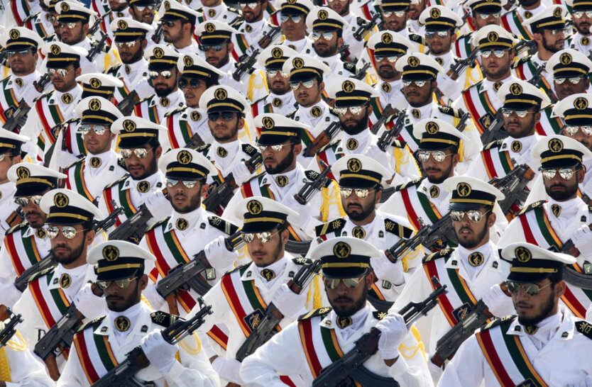 Members of the Iranian Revolutionary Guard Navy march during parade to commemorate anniversary of Iran-Iraq war, in Tehran