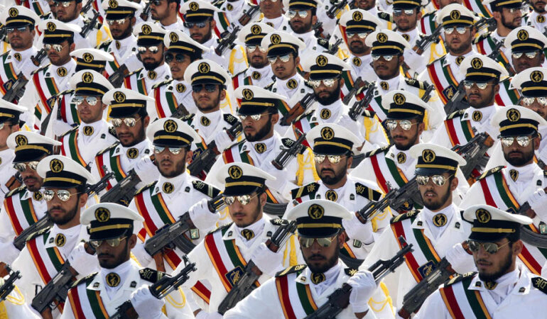 Members of the Iranian Revolutionary Guard Navy march during parade to commemorate anniversary of Iran-Iraq war, in Tehran