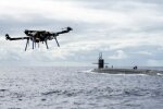 США испытали дрон для доставки груза на субмарину с ракетами