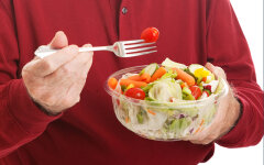 Senior Man Eats Salad — Closeup