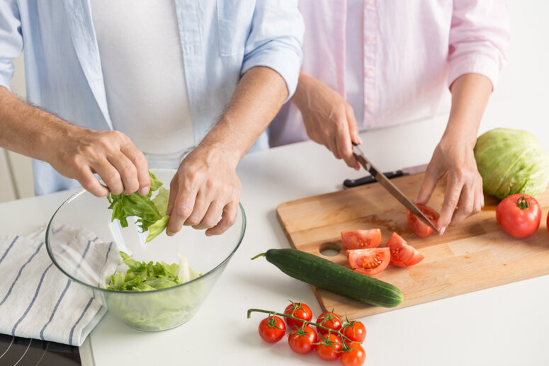Cropped picture of mature loving couple family cooking.
