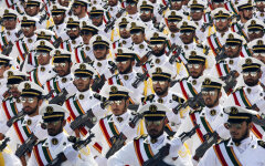 Members of the Iranian Revolutionary Guard Navy march during parade to commemorate anniversary of Iran-Iraq war, in Tehran