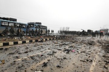 Indian soldiers examine the debris after an explosion in Lethpora in south Kashmir’s Pulwama district