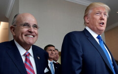 FILE PHOTO: Donald Trump walks with former New York City Mayor Rudolph Giuliani through the new Trump International Hotel in Washington